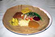 Injera - traditional ethiopian food. It is sour cake with meat or vegetable sauces. North, Ethiopia.