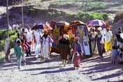 Going to place where main Timkat procession was formed. Lalibela. North, Ethiopia.
