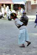 Water carrying from public pipe to house. Lalibela. North, Ethiopia.